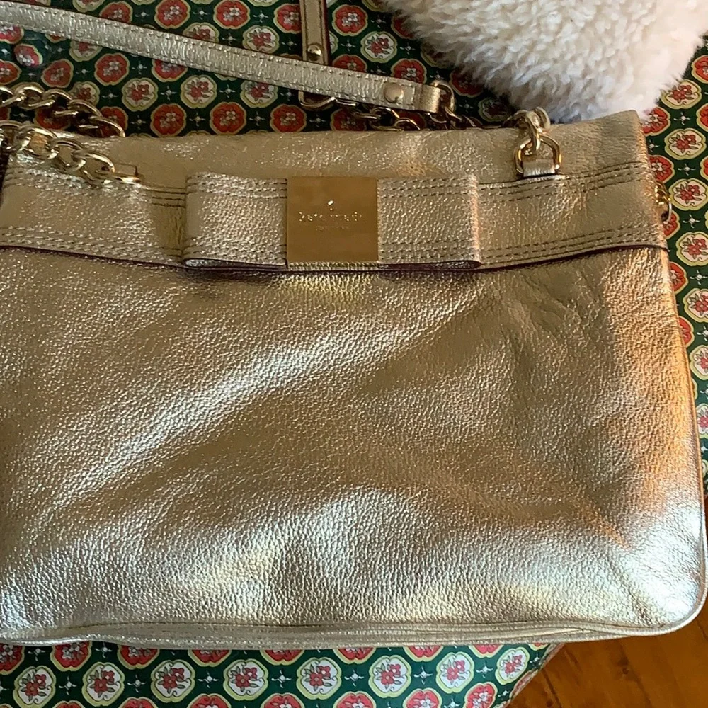 Kate spade gold metallic bow purse. Never used. Retail 298